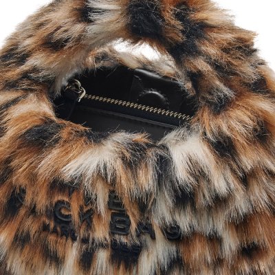 THE MICRO CROSSBODY SACK BAG IN LEOPARD FAUX FUR